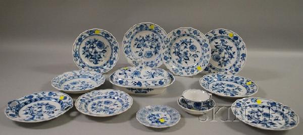 Thirteen Pieces of Meissen Blue Onion Pattern Porc: Thirteen Pieces of Meissen Blue Onion Pattern Porcelain Tableware, including two soups, a covered serving dish, seven plates, a bouillon cup, berry dish, and small plate with reticulated rim.