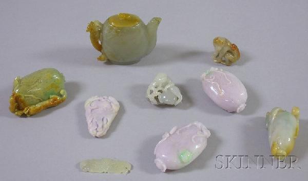 Nine Carved Stone Asian Items, including two purpl: Nine Carved Stone Asian Items, including two purple and green carved fruit with bats, a green and brown carved stone pendant with insects and mythical beast, a white monkey seated on a gray stone carv
