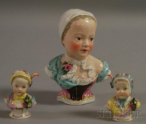 Meissen Hand-painted Porcelain Bust of a Girl and: Meissen Hand-painted Porcelain Bust of a Girl and Two Small Similar Busts, the Meissen with blue crossed swords mark, respective ht. 6 and 2 3/4 in.