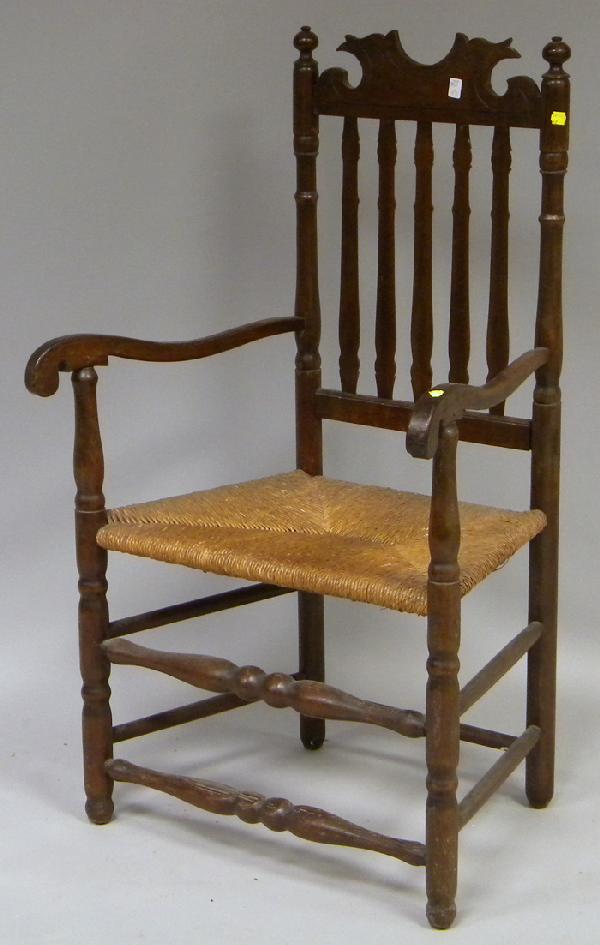 Bannister-back Armchair with Woven Rush Seat.: Bannister-back Armchair with Woven Rush Seat, (crest with later carving or replaced, stripped, refinished, wood grain raised, traces of red paint, wear, looseness).