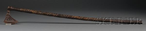 Indian Weapon, early 20th century, with an axe to : Indian Weapon, early 20th century, with an axe to one end and a spear to the other, cast in iron with inlay brass and openwork decoration, carved wood handle, lg. 40 1/4 in.