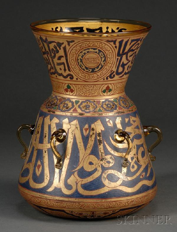 Gilt and Enameled Glass Mosque Lamp, Egypt/Syria, 1: Gilt and Enameled Glass Mosque Lamp, Egypt/Syria, 19th century, the slanting body and the trumpet-shaped neck decorated in blue and red enamels and gilt with calligraphy and floral scrolls, six lugs e