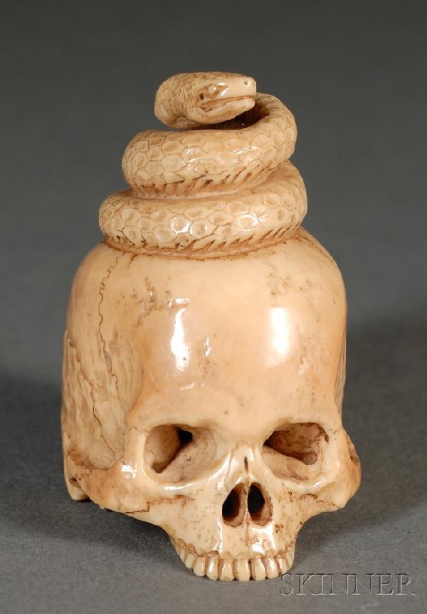 Ivory Netsuke, Japan, 19th century, study of a sna: Ivory Netsuke, Japan, 19th century, study of a snake coiled up atop a skull, ht. 1 7/8 in.