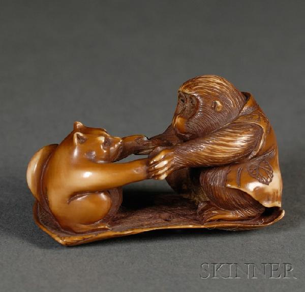 Ivory Netsuke, Japan, 19th century, a monkey in a : Ivory Netsuke, Japan, 19th century, a monkey in a vest wrestling a badger, both squatting on a rectangular mat, lg. 1 3/4 in.