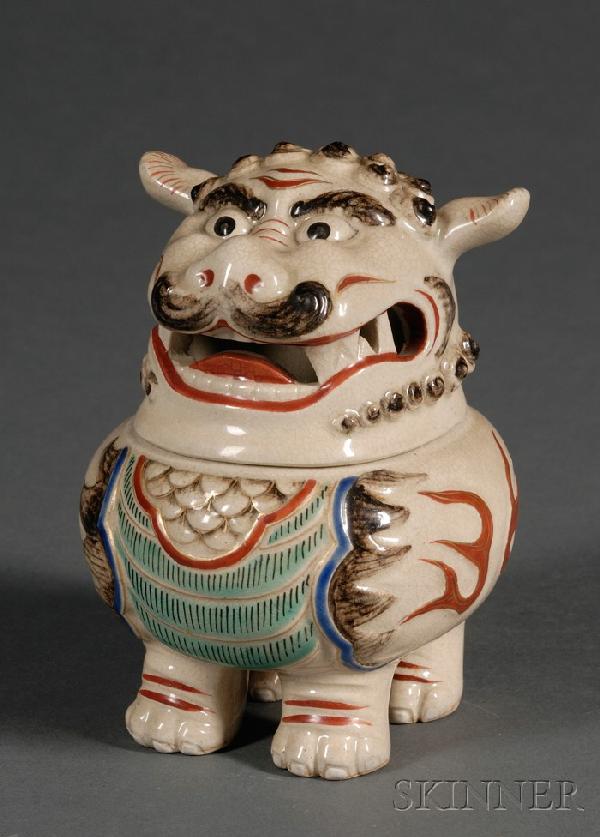 Kutani Foo Dog Censer and Cover, Japan, 19th centu: Kutani Foo Dog Censer and Cover, Japan, 19th century, modeled in the shape of a foo dog with curly mane, alerted ears, and bushy tail, its paws forming the feet of the censer, Kutani Kosen-gama iron-r