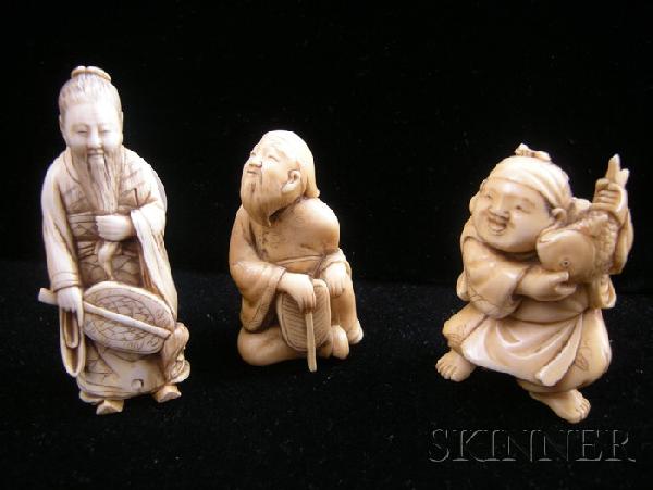 Three Ivory Carvings, Japan, 19th century, an old : Three Ivory Carvings, Japan, 19th century, an old man seated and holding a fan, a merchant selling a big fish, and an old man holding a fan in his right hand and his beard in his left, ht. 2 1/8, 2 1/