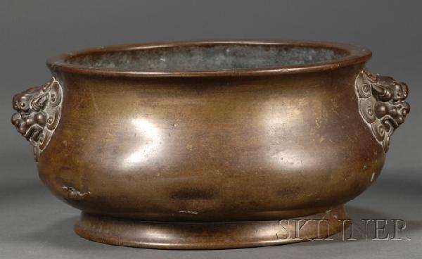 Bronze Censer, China, 18th century, of archaic bro: Bronze Censer, China, 18th century, of archaic bronze gui shape, flanked by lion-mask lugs, engraved with Xuande six-character mark on the base, dia. 7 1/4, ht. 3 7/8 in.