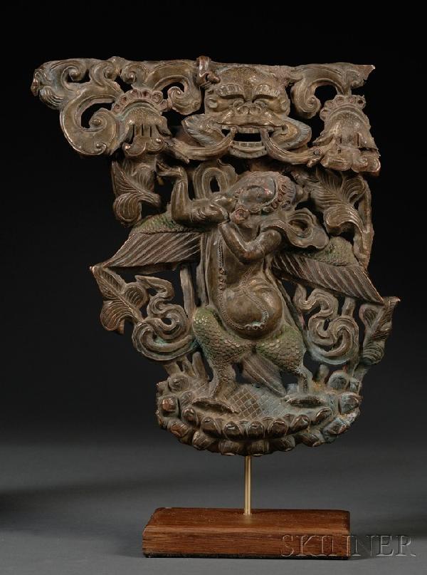 Bronze Plaque, Tibet, 18th century, repousse desig: Bronze Plaque, Tibet, 18th century, repousse design of a divinity and a lion, displayed on a stand, ht. 11, wd. 9 1/4 in.