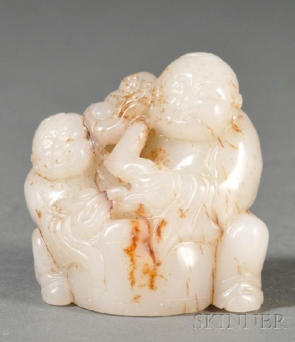 Jade Carving, China, carving of two Buddhist monk: Jade Carving, China, carving of two Buddhist monks seated behind a drum, one carrying an ingot, the other holding a lingzhi sprig, the stone of white color with russet markings, ht. 2 1/2, lg. 2 1/8 i