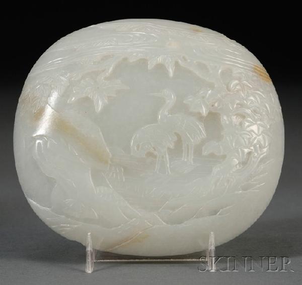 Jade Plaque, 18th/19th century, in the form of a : Jade Plaque, 18th/19th century, in the form of a ruyi scepter, pale green with russet marking, relief decoration of a pair of cranes in a landscape, 5 1/2 x 4 1/2 in., (chips).