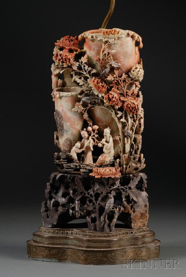 Soapstone Vase Lamp, China, finely carved in high: Soapstone Vase Lamp, China, finely carved in high relief of two Immortals with an attendant, one of them Shoulao, in a rustic landscape with birds and peony blossoms, two-part stand, one cast with bir