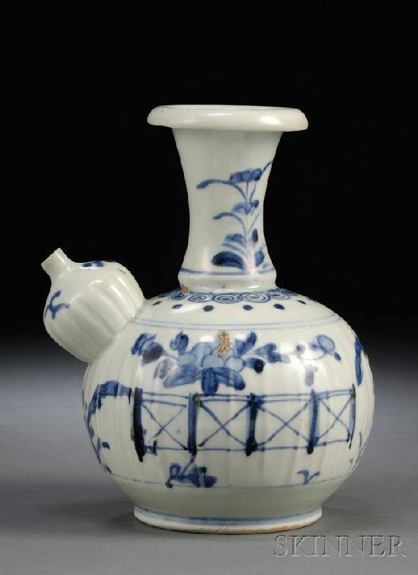 Blue and White Porcelain Kendi, China, 17th centu: Blue and White Porcelain Kendi, China, 17th century, painted around the slightly ribbed body in underglaze blue of plantain trees and fruit sprays, the bulbous spout on the shoulder also ribbed, with 