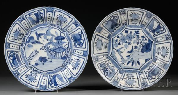 Pair of Blue and White Plates, China, probably la: Pair of Blue and White Plates, China, probably late Ming, the central medallions painted with scenes of wild geese in lotus pond, and birds in flight amidst flower trees and rockworks, the everted wid