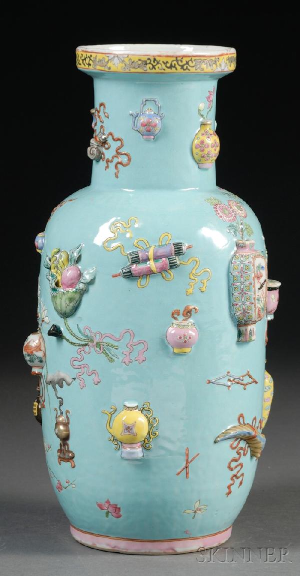 Relief Decorated Vase, China, 19th century, the t: Relief Decorated Vase, China, 19th century, the tall ovoid body with relief molded decoration of a variety of antique objects, with lotus blooms, iris, Buddha's hand citron, prunus, lingzhi sprigs, et