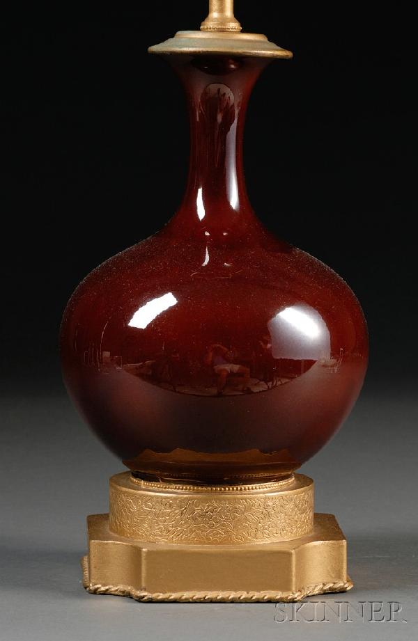 Sang-de-Boeuf Vase, China, bottle vase shape, set: Sang-de-Boeuf Vase, China, bottle vase shape, set on chased brass mounts and converted to a table lamp, vase ht. 8 3/4, lamp ht. 24 1/2 in.