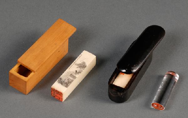 Three Seals, China and Japan, an ivory seal toget: Three Seals, China and Japan, an ivory seal together with red paste in a horn case; another incised with a lady in a pavilion to one side and a poem to the other, in a boxwood case; the third one of r