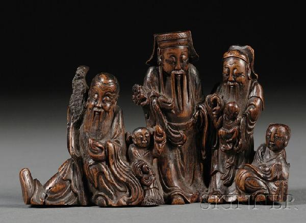 Brush Stands, China, one cast into a prunus branc: Brush Stands, China, one cast into a prunus branch, the other of carved wood as three Taoist Immortals and attendants, together with a calligraphy brush of ivory shaft with fine incising of dragon, lg