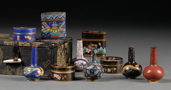 Assorted Ten Cloisonne Enameled Wares, China, fiv: Assorted Ten Cloisonne Enameled Wares, China, five bottle vases, three circular boxes and covers, and two flat square cases, decorated with motif of antique objects, flower branches, and dragons, resp