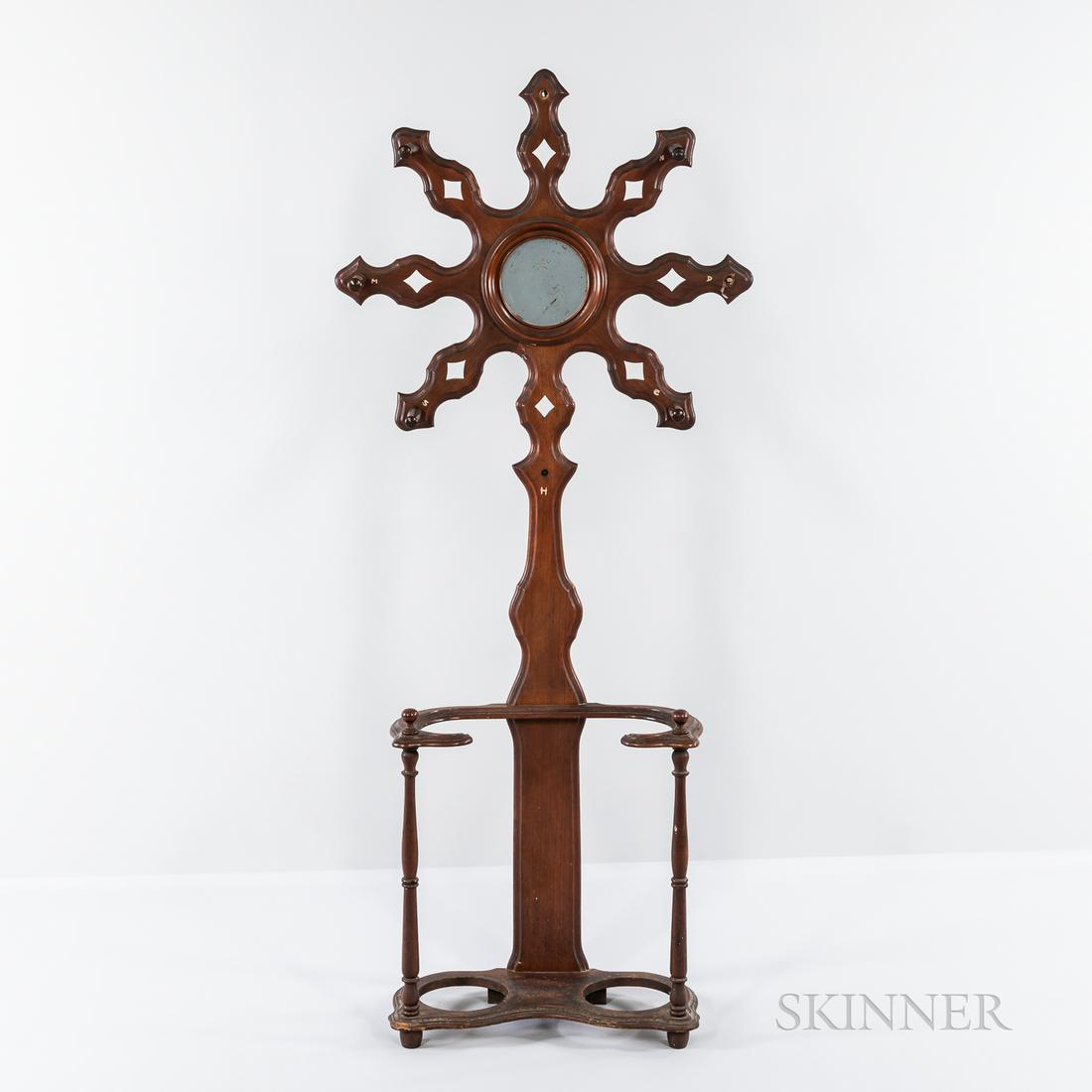 Victorian Walnut Hall Tree with Mirror, America, 19th: Victorian Walnut Hall Tree with Mirror, America, 19th century, round mirror set amongst radiating reticulated arms with spokes at each end, all above a two-section umbrella stand, ht. 76 1/2, wd. 33 1