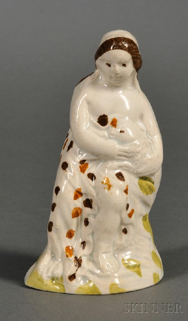 Small Pratt-type Staffordshire Pearlware Figure, Eng: Small Pratt-type Staffordshire Pearlware Figure, England, late 18th/early 19th century, depicting a small child holding a lamb, underglaze enamel decoration, ht. 3 7/8 in.