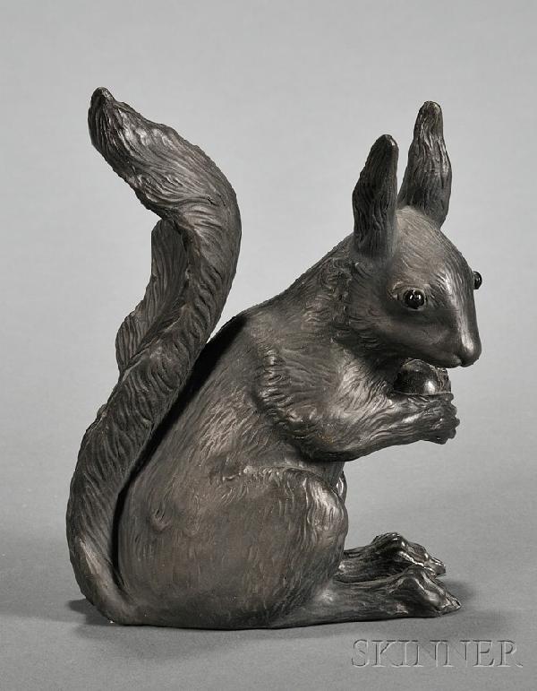 Wedgwood Black Basalt Squirrel, England, c. 1918, : Wedgwood Black Basalt Squirrel, England, c. 1918, by Ernest Light, with glass eyes, modeled holding a nut, impressed mark, ht. 5 1/2 in.