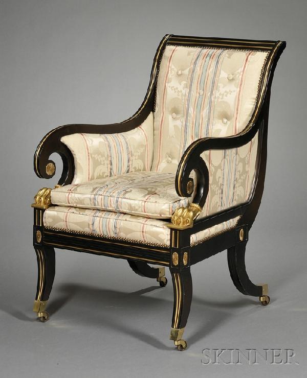 Empire Style Ebonized and Parcel-gilt Bergere, 20t: Empire Style Ebonized and Parcel-gilt Bergere, 20th century, Baker Furniture, with scrolled backrest and arms with paw form supports, silk upholstered backrest and seat, reeded apron and saber legs, o