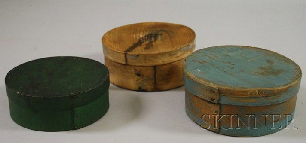 Three Small Round Lapped-seam Pantry Boxes, one pa: Three Small Round Lapped-seam Pantry Boxes, one painted blue, one green, the other with vestiges of blue paint.