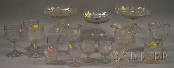 Fifteen Pieces of Colorless Pressed Hamilton Patt: Fifteen Pieces of Colorless Pressed Hamilton Pattern Flint Glass Tableware, three compotes, four wines, a tumbler, cordial, three goblets, a footed jug, spooner, and celery.