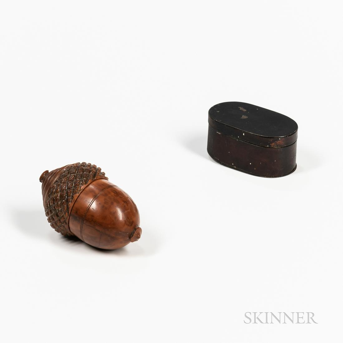 Two Nutmeg Graters, probably early 19th century,: Two Nutmeg Graters, probably early 19th century, including an acorn-shaped hardwood carved and turned example, and an oval example in tin, lg. to 3 in.