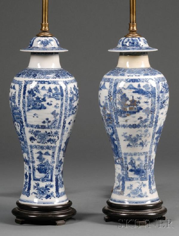 Pair of Chinese Export Porcelain Garniture Vases Mo: Pair of Chinese Export Porcelain Garniture Vases Mounted as Lamps, late 18th/early 19th century, with blue underglaze decoration depicting panels of Chinese waterway landscapes, with traces of gilt hi