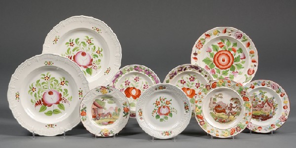 Nine Decorated Pearlware Plates, England, early 19: Nine Decorated Pearlware Plates, England, early 19th century, each plate with assorted embossed rim borders, two dinner plates with embossed anthemion leaf rim borders, decorated with a large hand-pai