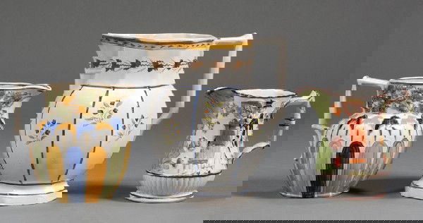 Three Decorated Earthenware Pitchers, England, ear: Three Decorated Earthenware Pitchers, England, early 19th century, two Pratt-type with typical coloration, one paneled with flower sprigs and sepia leaf border around rim, the other with grapevine rim