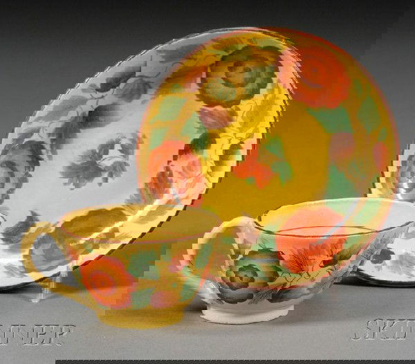 Floral Decorated Yellow Glazed Earthenware Cup an: Floral Decorated Yellow Glazed Earthenware Cup and Saucer, Britain, c. 1820, with brightly painted floral motifs, dia. 4 1/4 in.