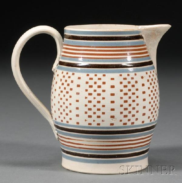 Engine-turned Mochaware Jug, Britain, c. 1800, bal: Engine-turned Mochaware Jug, Britain, c. 1800, baluster-form pearlware jug banded with blue, black, and rust with an inlaid rust engine-turned geometric pattern, ht. 5 in.