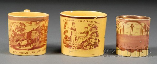 Three Yellow-glazed Children's Mugs, Britain, earl: Three Yellow-glazed Children's Mugs, Britain, early 19th century, two mugs with red transfer prints and sayings: "A Present for a Good Girl" and "Hay While the Sun Shines"; the other painted in red wi