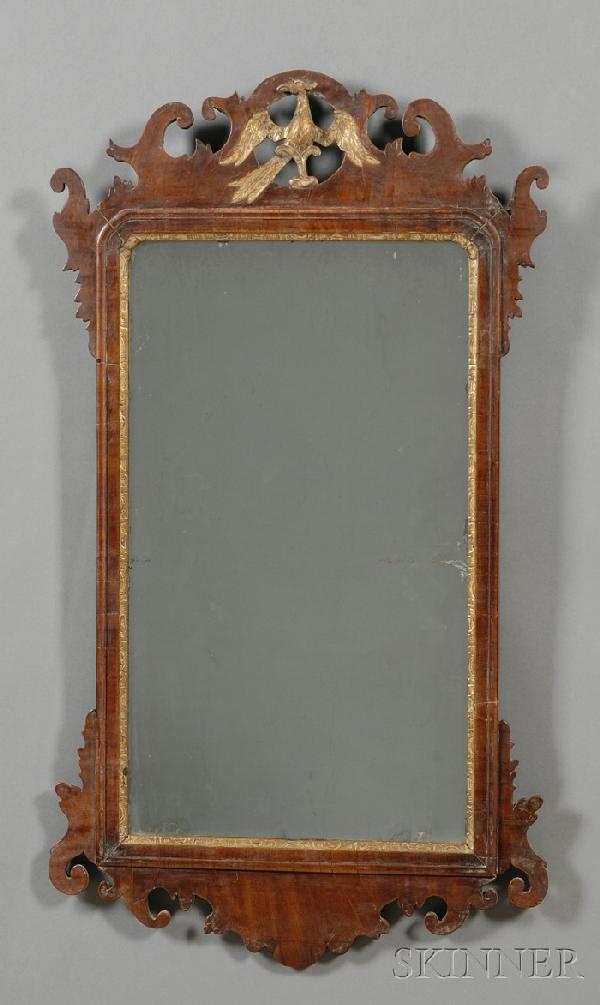 Chippendale Mahogany Gilt-gesso Mirror, the scroll: Chippendale Mahogany Gilt-gesso Mirror, the scrolled and pierced frame with eagle in crest, the glass with gilt liner, old surface, (imperfections), ht. 40, wd. 19 in.