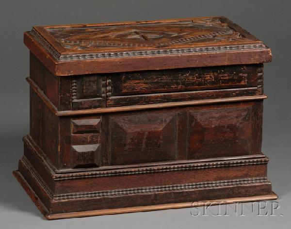Paneled and Carved Walnut Puzzle Box, Boston, 19t: Paneled and Carved Walnut Puzzle Box, Boston, 19th century, the box top with applied diamond-shaped reserve ornamented with cruciforms and arrows, the sides with applied raised chamfered panels and ri