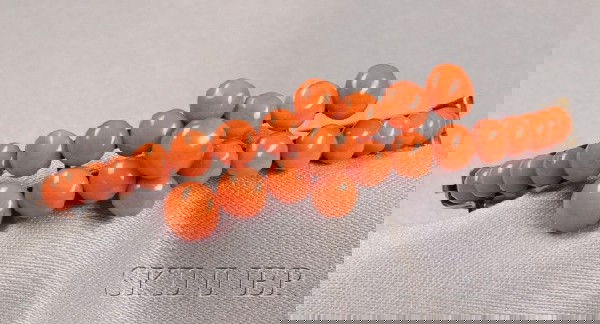 Antique Coral Bracelet, the hinged bangle set with: Antique Coral Bracelet, the hinged bangle set with central floral motif of coral buttons, completed by coral beads, gilt mount, interior cir. 6 3/8 in.