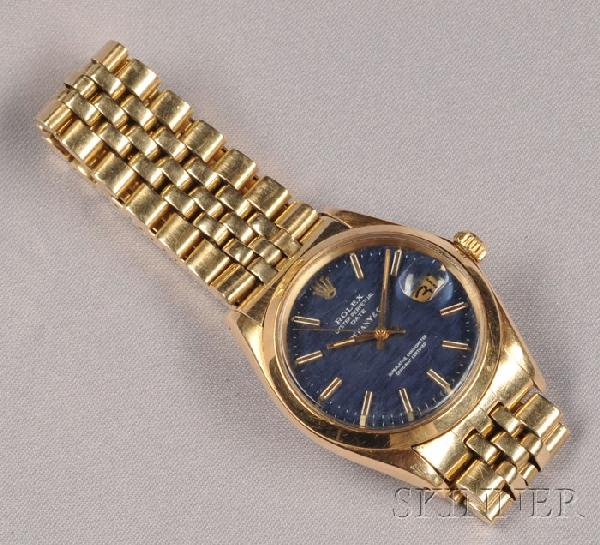 14kt Gold Wristwatch, Rolex, Tiffany & Co., "Oyste: 14kt Gold Wristwatch, Rolex, Tiffany & Co., "Oyster Perpetual Date," the blue dial with baton numeral indicators and date aperture, enclosing an automatic movement, completed by Jubilee bracelet with