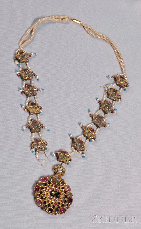 Antique 22kt Gold, Enamel, and Gem-set Necklace, I: Antique 22kt Gold, Enamel, and Gem-set Necklace, India, set with rubies, emeralds, and diamonds, and with seed pearls, reverse with polychrome enamel, in a Georg Jensen Inc., New York, box, (damage). 