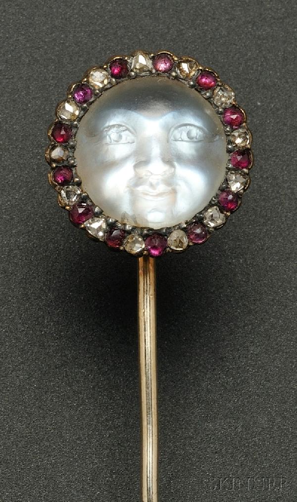 Antique Carved Moonstone Stickpin, depicting a moo: Antique Carved Moonstone Stickpin, depicting a moon face, framed by rubies and rose-cut diamonds, gold and silver mount, lg. 2 7/8 in. boxed.