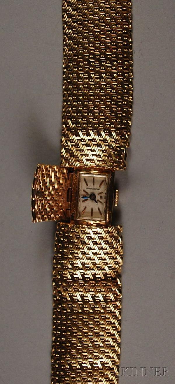 Lady's Movado 14kt Gold Bracelet Wristwatch, back: Lady's Movado 14kt Gold Bracelet Wristwatch, back of case inscribed "M.T.K. 2-4-64", total 29.3 dwt, lg. 6 3/4 in. Provenance: Sold by the Peabody Essex Museum, Salem, Massachusetts, for the benefit o