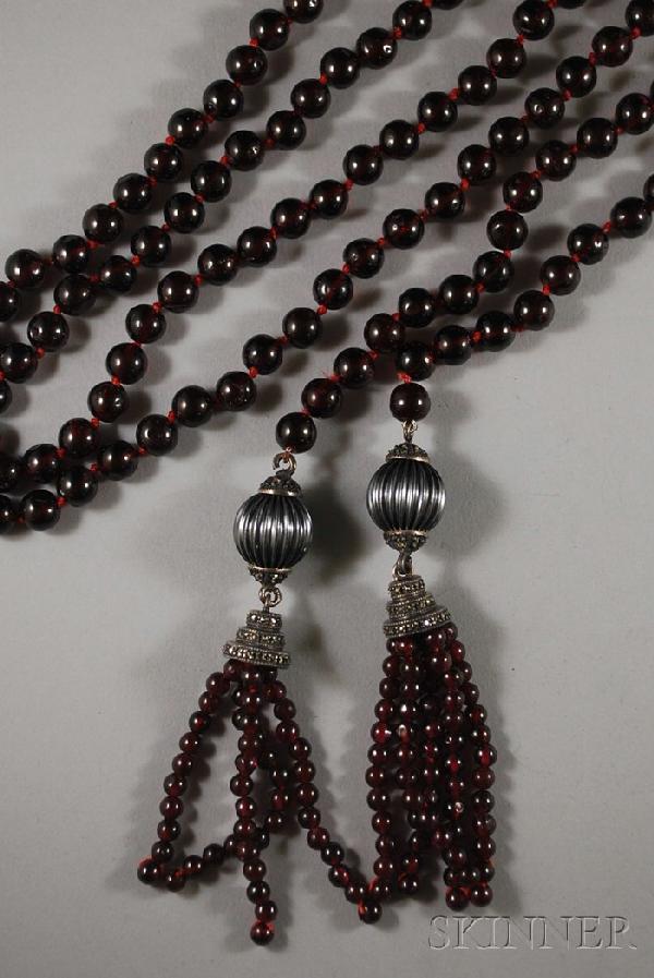 Garnet Lariat Necklace, composed of garnet beads w: Garnet Lariat Necklace, composed of garnet beads with garnet, silver, and marcasite tassels, lg. 52 in., (some beads scratched or nicked).