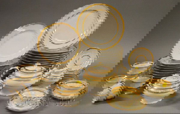 Three Partial Sets of Gilt and Decorated Porcelain: Three Partial Sets of Gilt and Decorated Porcelain Tableware, a seven-piece Mintons tea set, eleven Bernardaud plates, and twenty-two-piece partial Paris set.