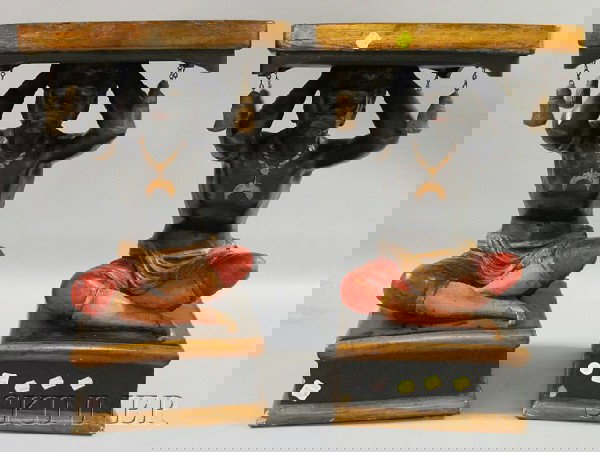 Pair of Painted Plaster Seated Blackamoor Figural: Pair of Painted Plaster Seated Blackamoor Figural Stands, on low bases, overall ht. 24, wd. 14 in. Provenance: The Collection of Anne Babchyck.