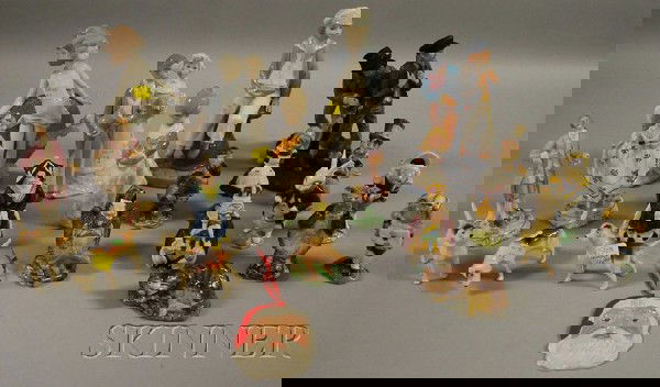 Approximately Twenty-two Assorted Ceramic Collecti: Approximately Twenty-two Assorted Ceramic Collectible Figurals, including four Lladro figures, a pair of Portuguese figures, eleven Royal Doulton/Beswick Alice in Wonderland figures, three Beswick dog