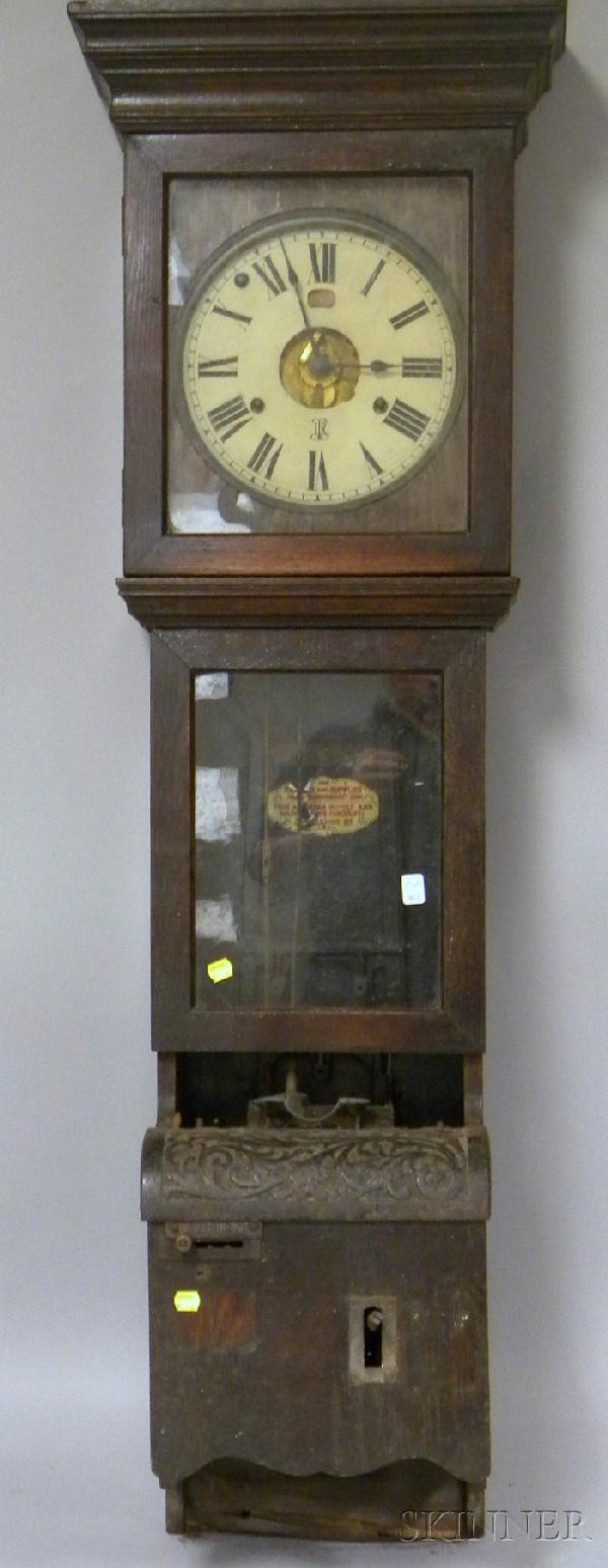 Oak Wall Mounted Time Clock by the International: Oak Wall Mounted Time Clock by the International Time Recording Company, with Roman numeral dial, looking glass mid section, punch card mechanism in the base, eight-day time only spring powered moveme