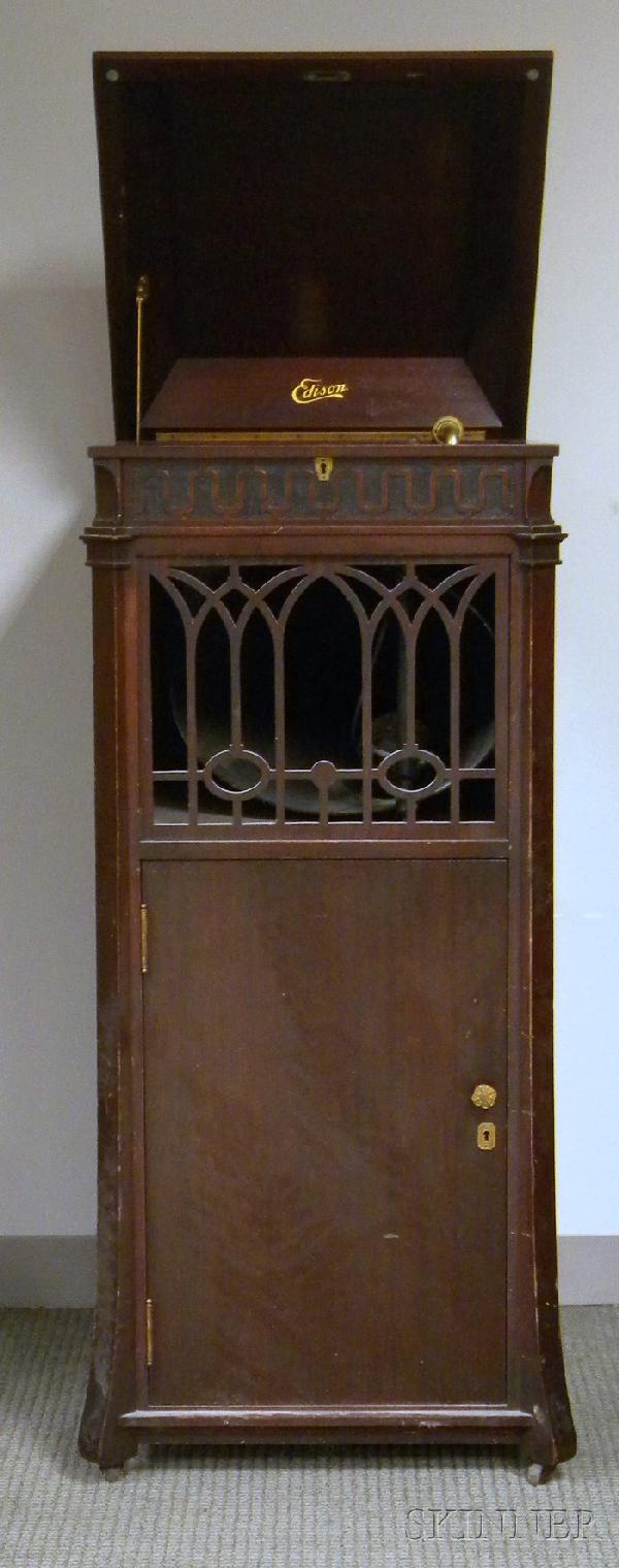 Mahogany Edison Disc Phonograph, c. 1912, model: Mahogany Edison Disc Phonograph, c. 1912, model C250, with hinged lid, soundbox, and two drawers with a collection of period Edison records, ht. closed 52 in.