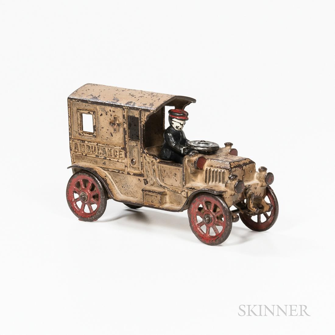 Cast Iron Ambulance Toy, Kenton, late 19th century,: Cast Iron Ambulance Toy, Kenton, late 19th century, cream painted truck with figure and steering wheel, (paint wear), lg. 7 1/4 in.