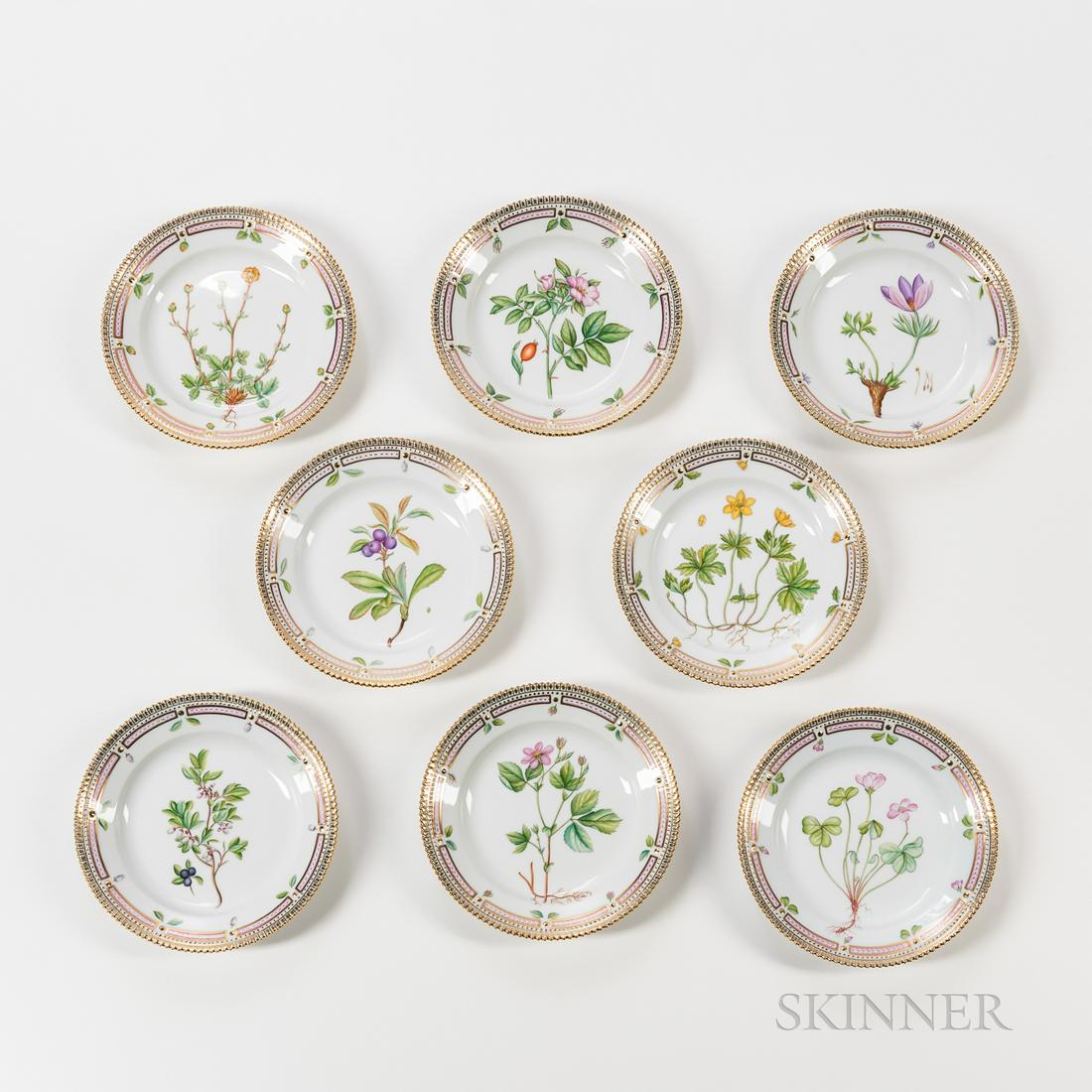 Eight Royal Copenhagen Flora Danica Bread Plates,: Eight Royal Copenhagen Flora Danica Bread Plates, Denmark, second half 20th century, each with gilt highlights overall, painted with botanical specimens, factory marks and inscribed with Latin specime